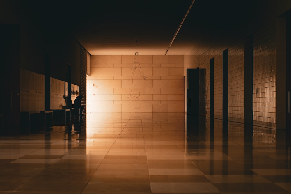 a person sitting at a table in a dimly lit room