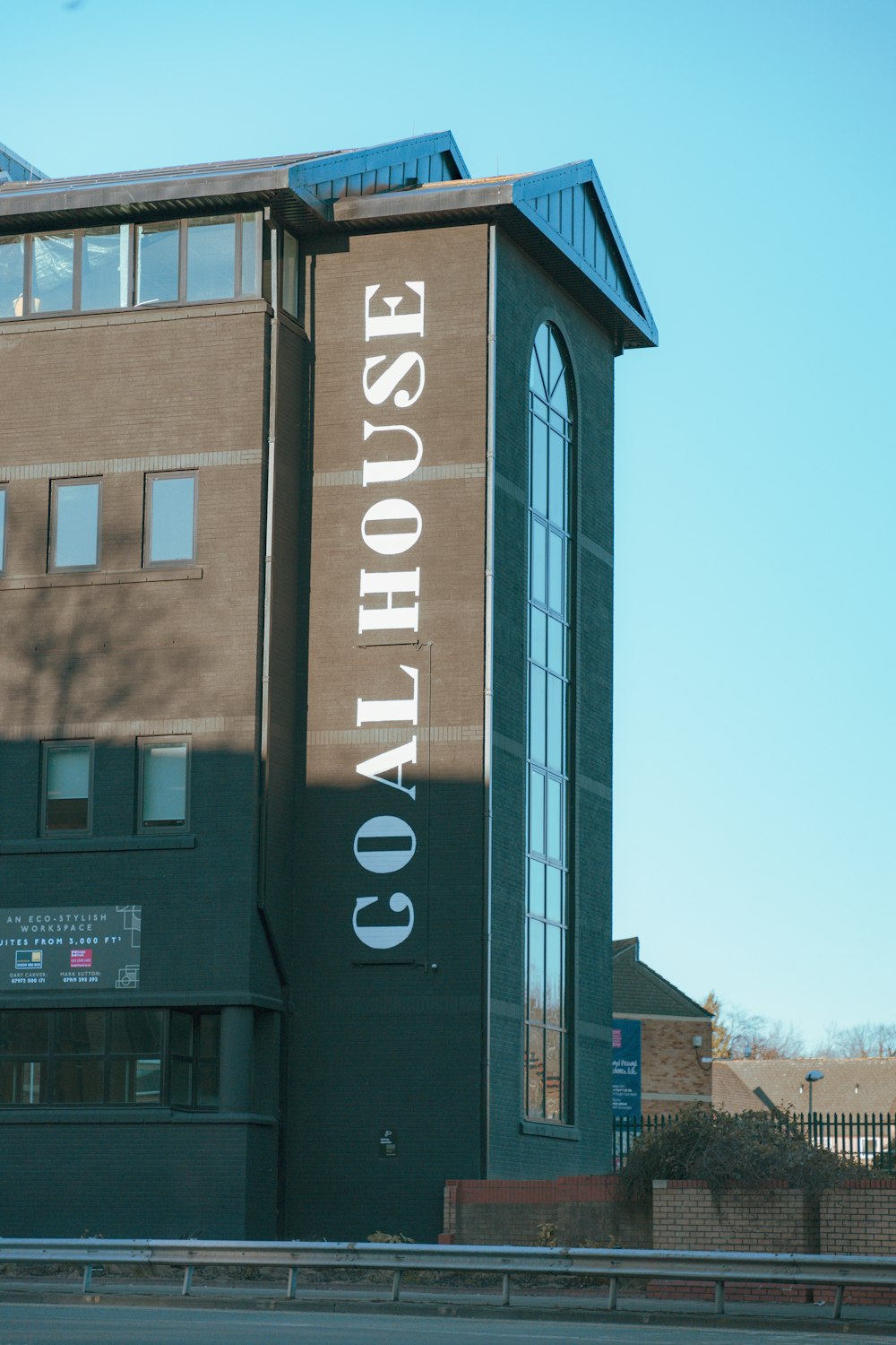 a tall building with a sign on the side of it