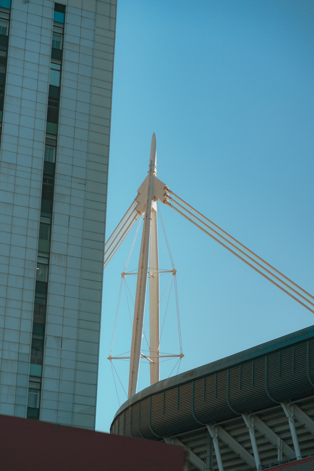 a tall white building next to a tall white building