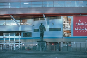 a large building with a statue in front of it