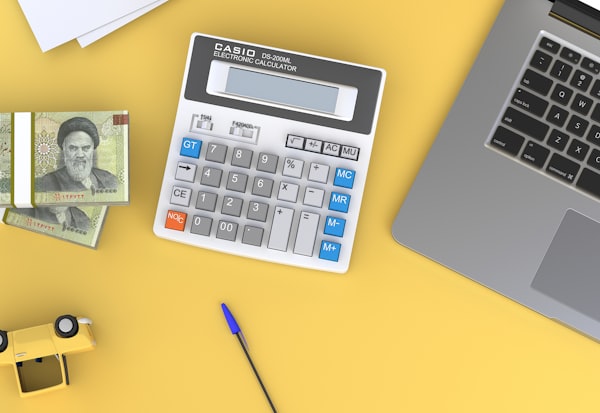Calculator and documents on a desk