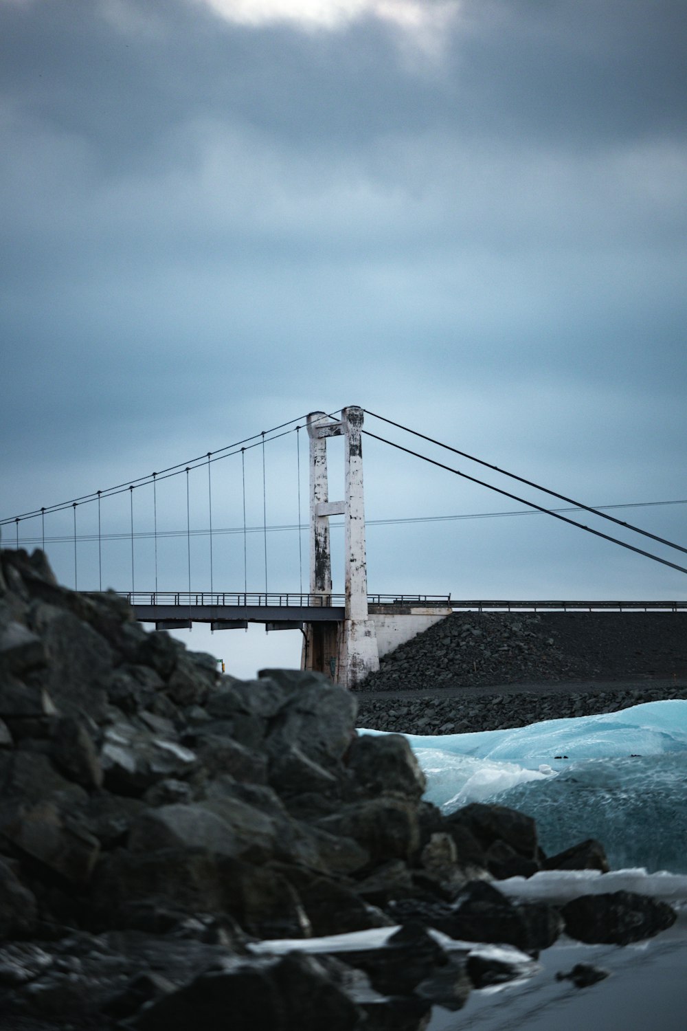 a suspension bridge over a body of water