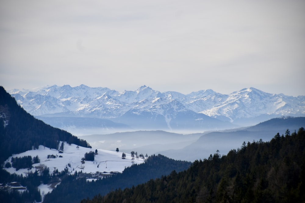 a view of a mountain range covered in snow