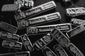 pile of silver on table for Gold IRA investment blog post on potential benefits of silver in an IRA