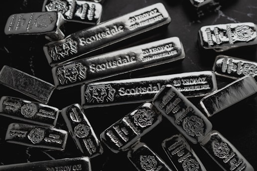 pile of silver on table for Gold IRA investment blog post on potential benefits of silver in an IRA