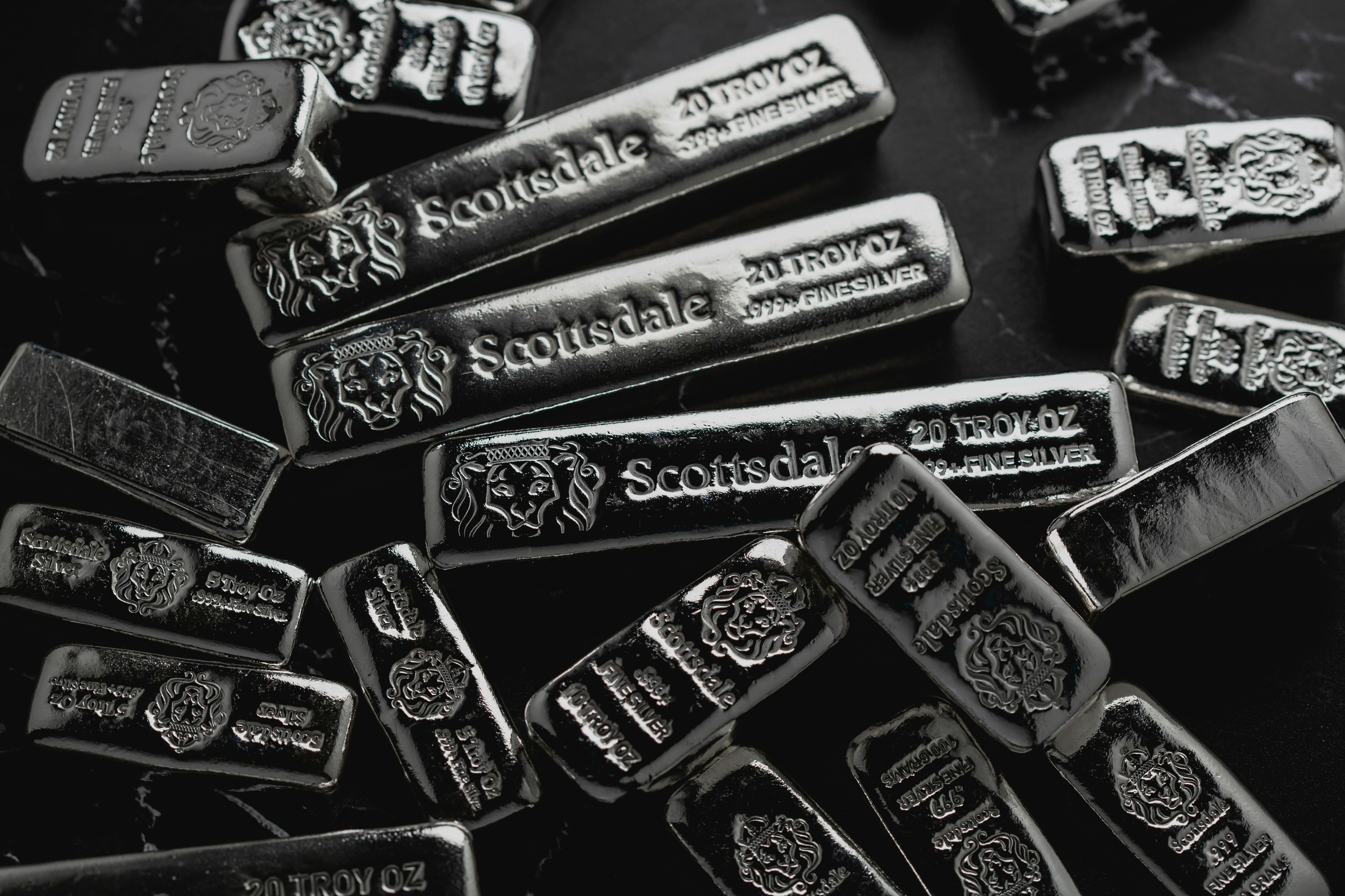 Scottsdale Mint cast silver bars stacked in a pile.