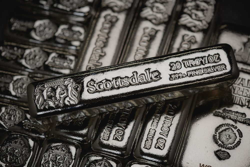 a pile of silver bars sitting on top of each other