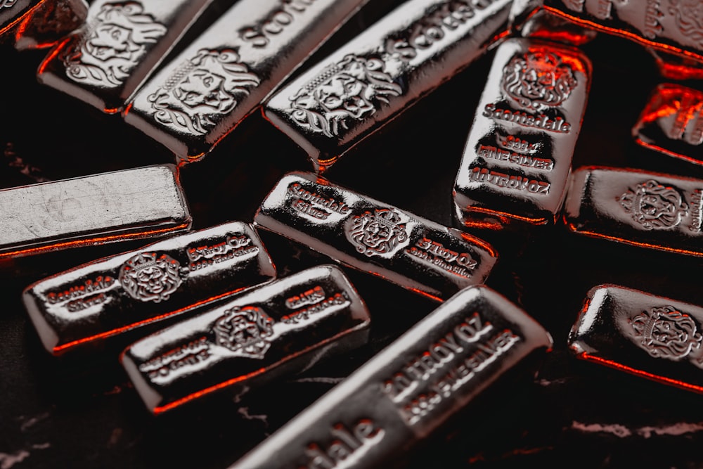 a pile of silver bars sitting on top of a table