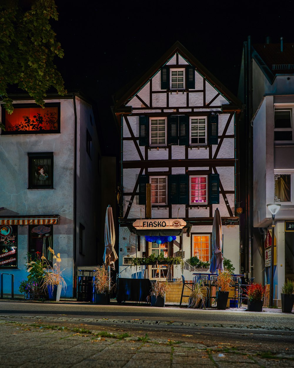 a row of buildings sitting next to each other on a street