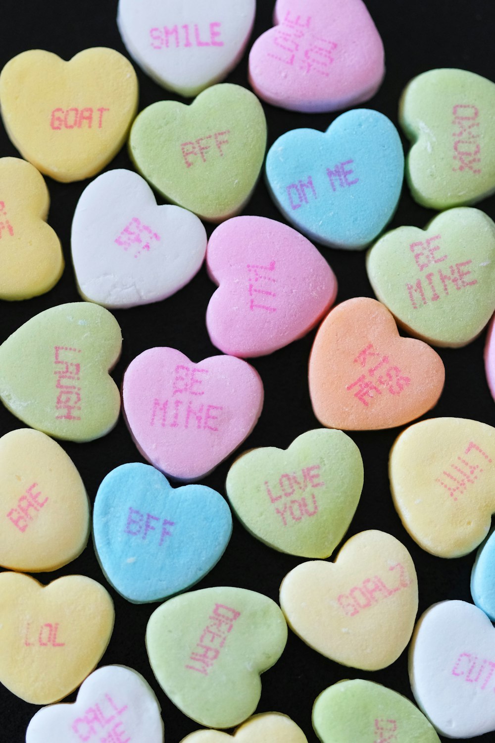 conversation hearts with the words smile on them