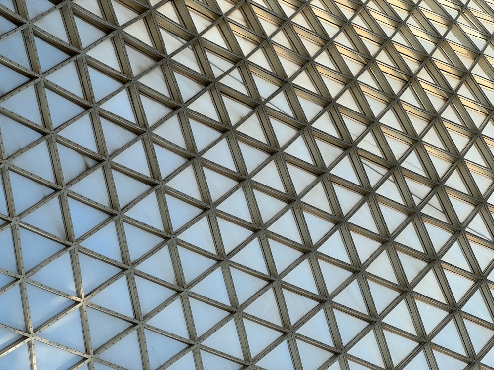 a close up of a metal structure with a sky background