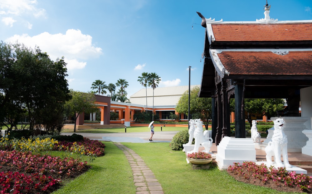 a garden with statues of animals in the middle of it