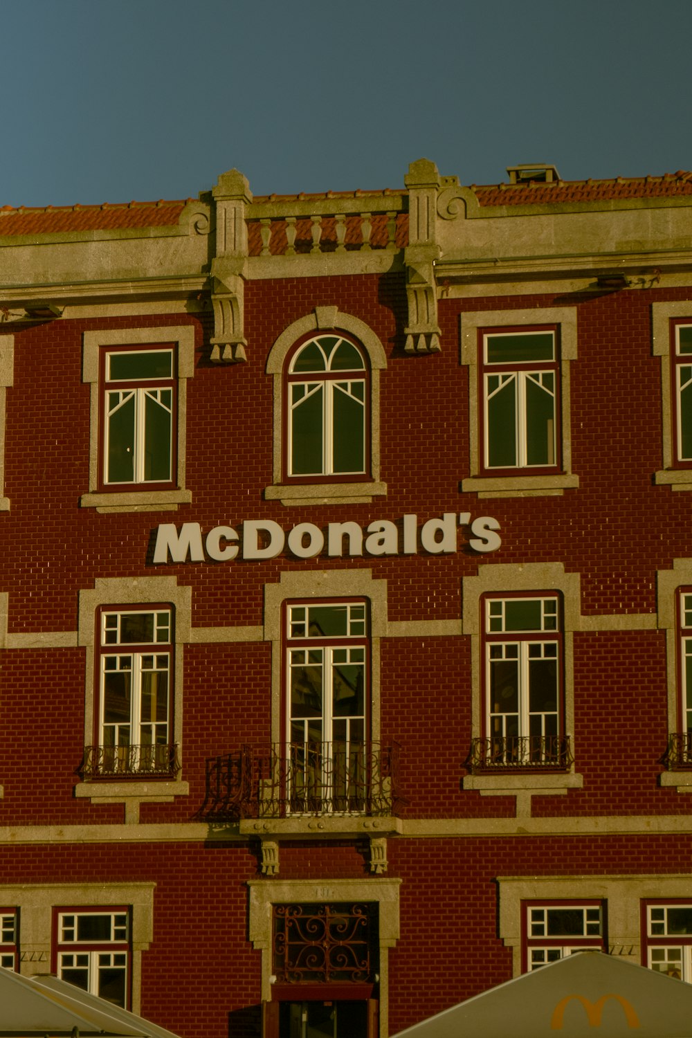 a red brick building with a mcdonald's sign on it