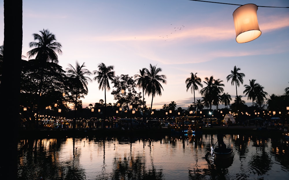 a lamp hanging over a body of water