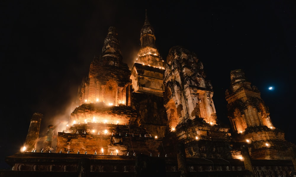 a large building with many spires lit up at night