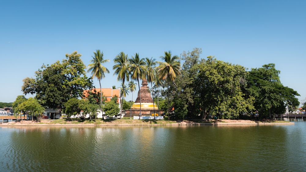 a body of water surrounded by trees and buildings