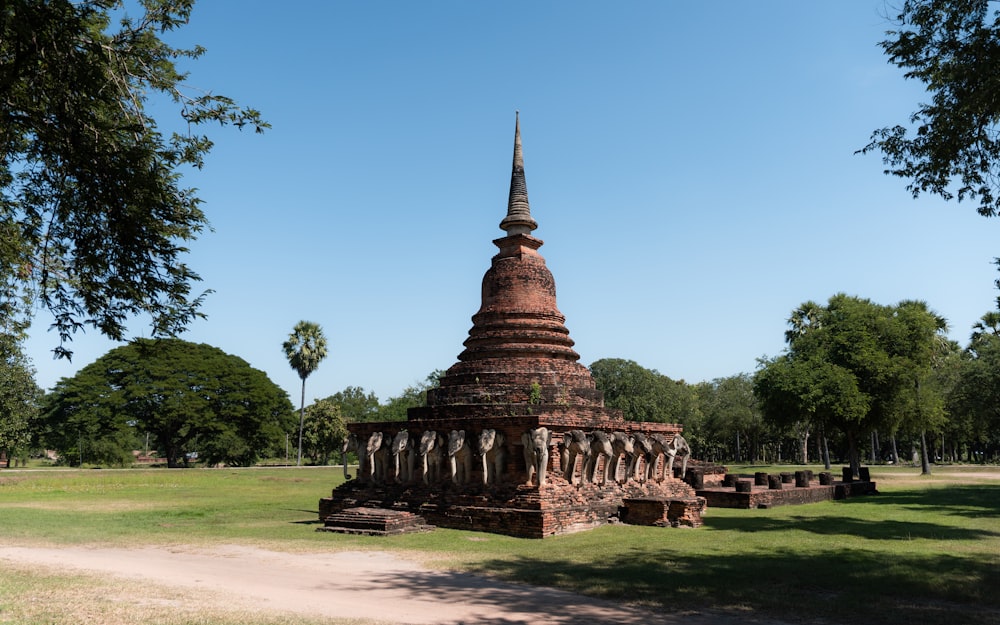 a large brick structure in the middle of a park