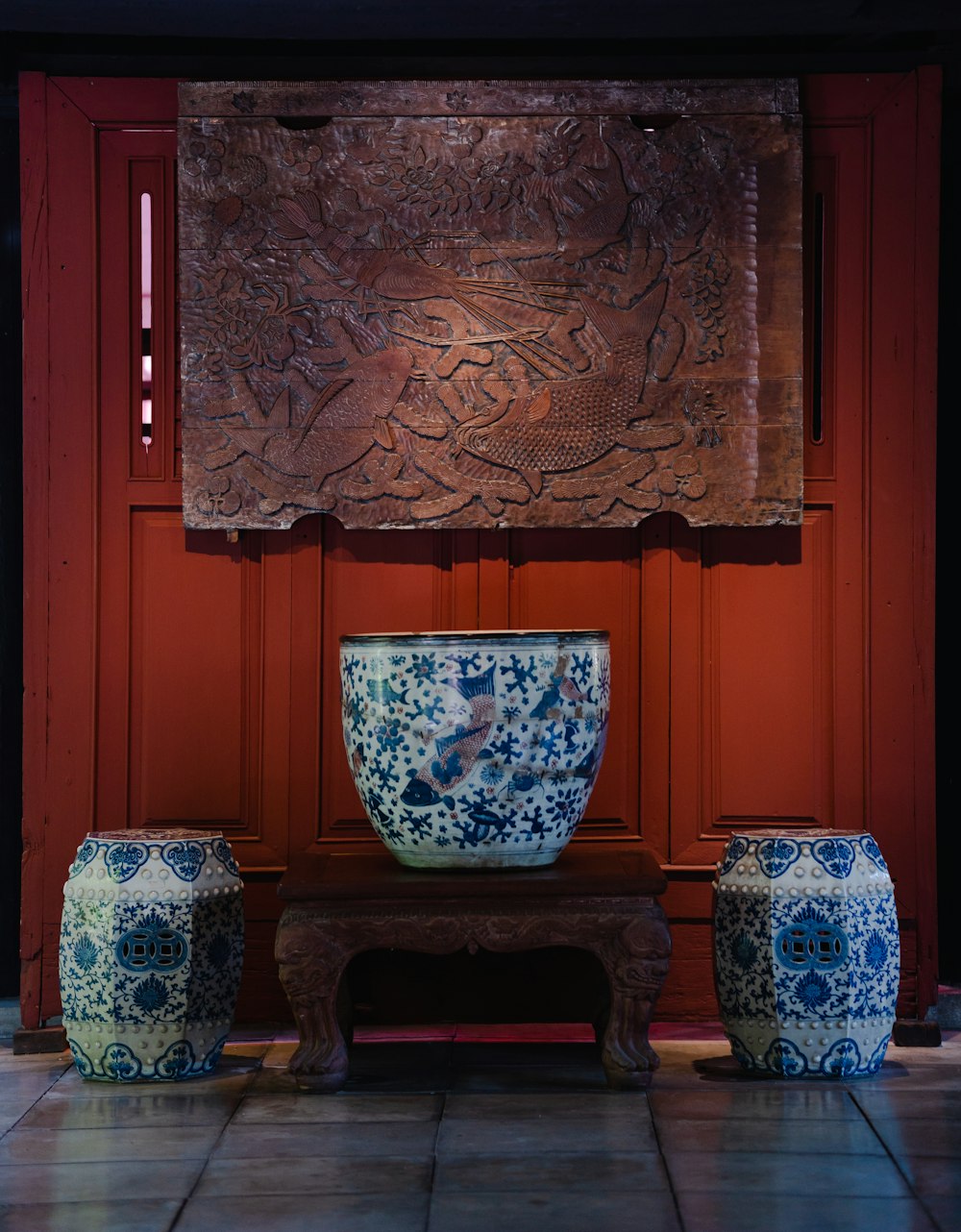 a blue and white vase sitting on top of a table