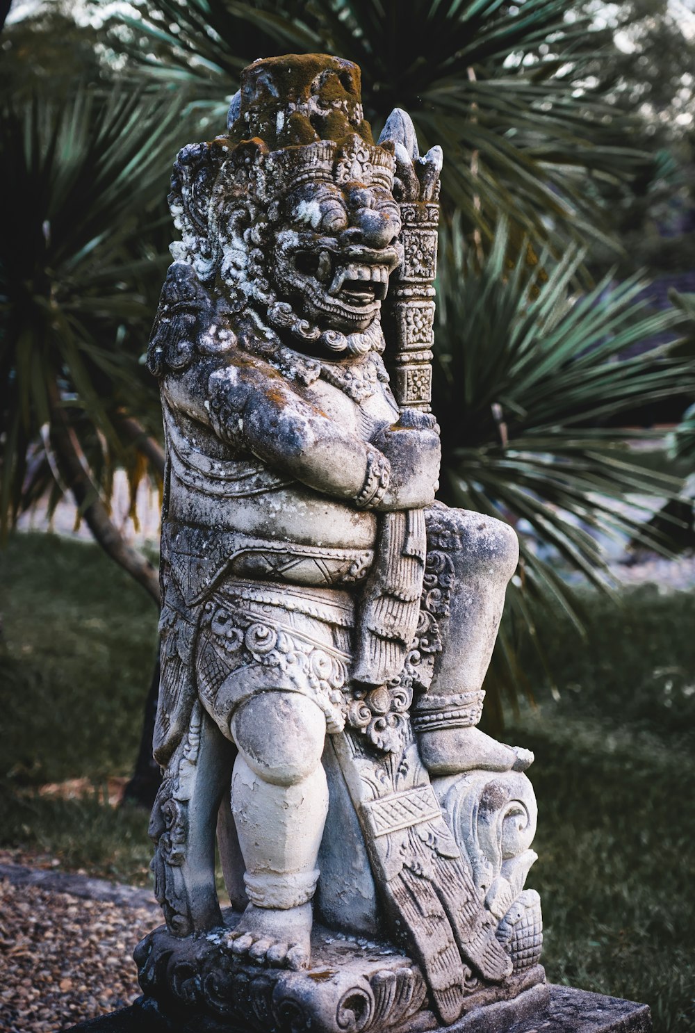 a statue of a man holding a sword