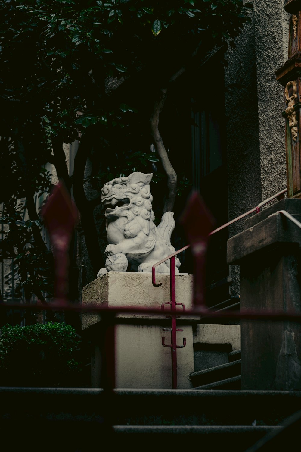 a statue of a woman sitting on top of a cement block