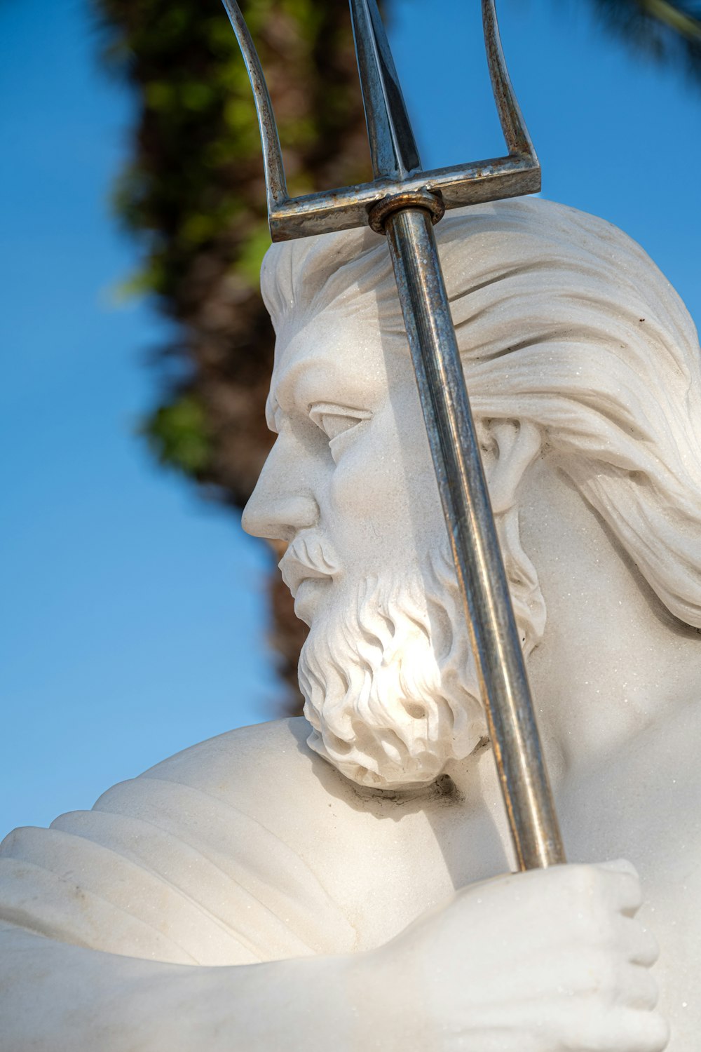 a statue of a man holding a sword