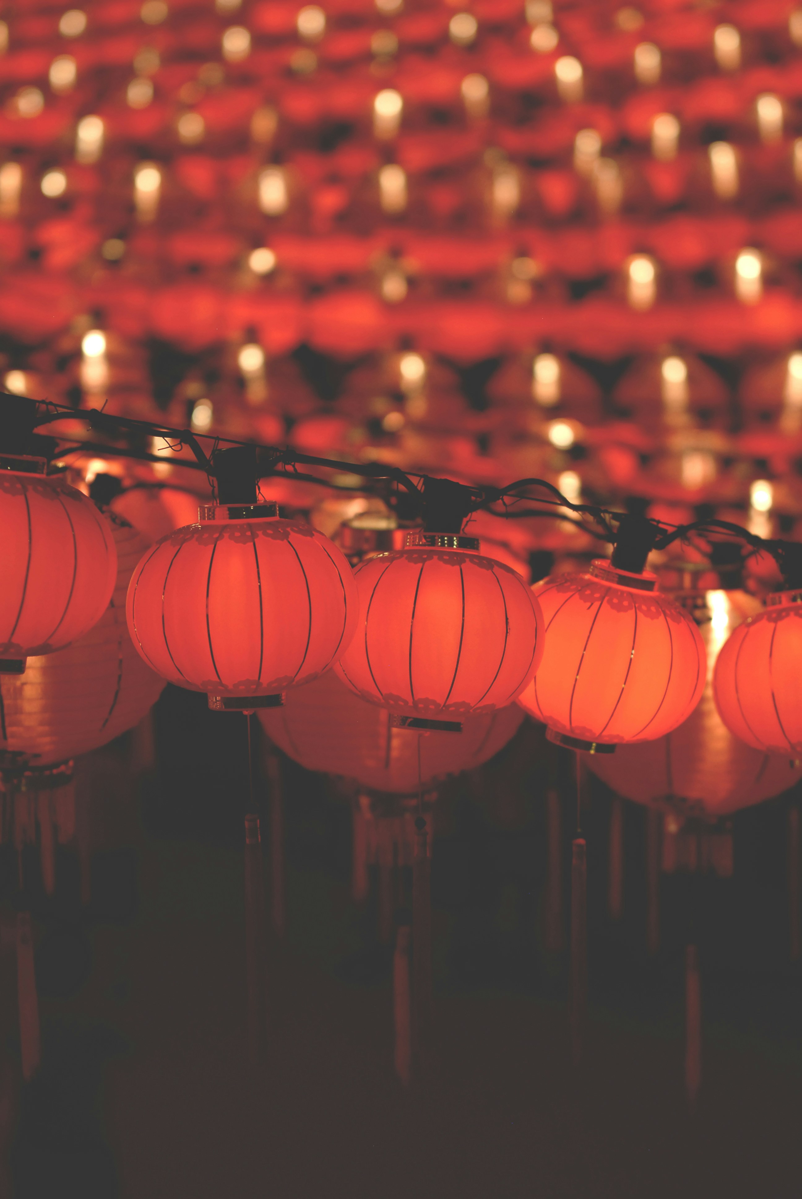 a row of red lanterns sitting next to each other
