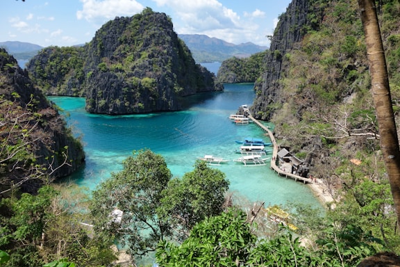 a group of boats that are sitting in the water