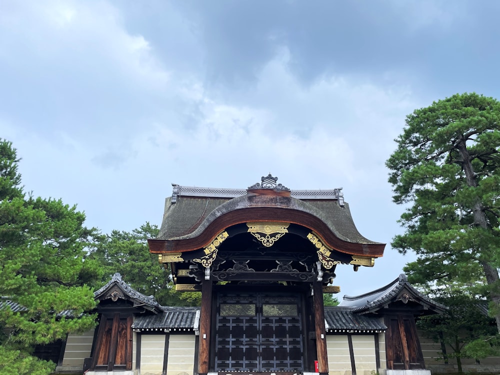 a tall building with a wooden door and roof