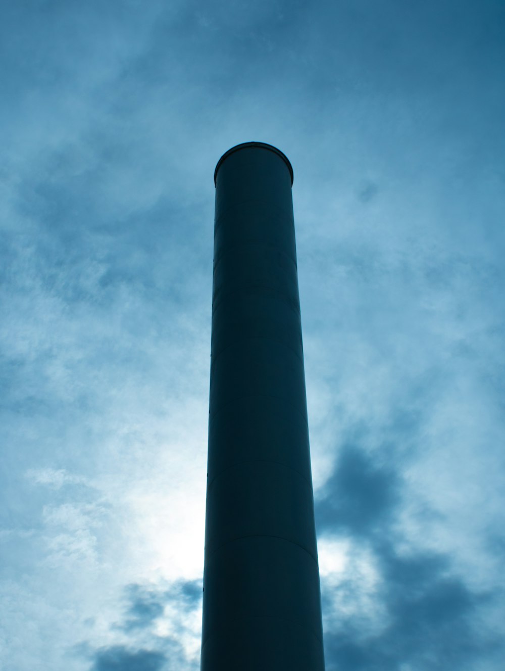 a tall tower with a sky in the background