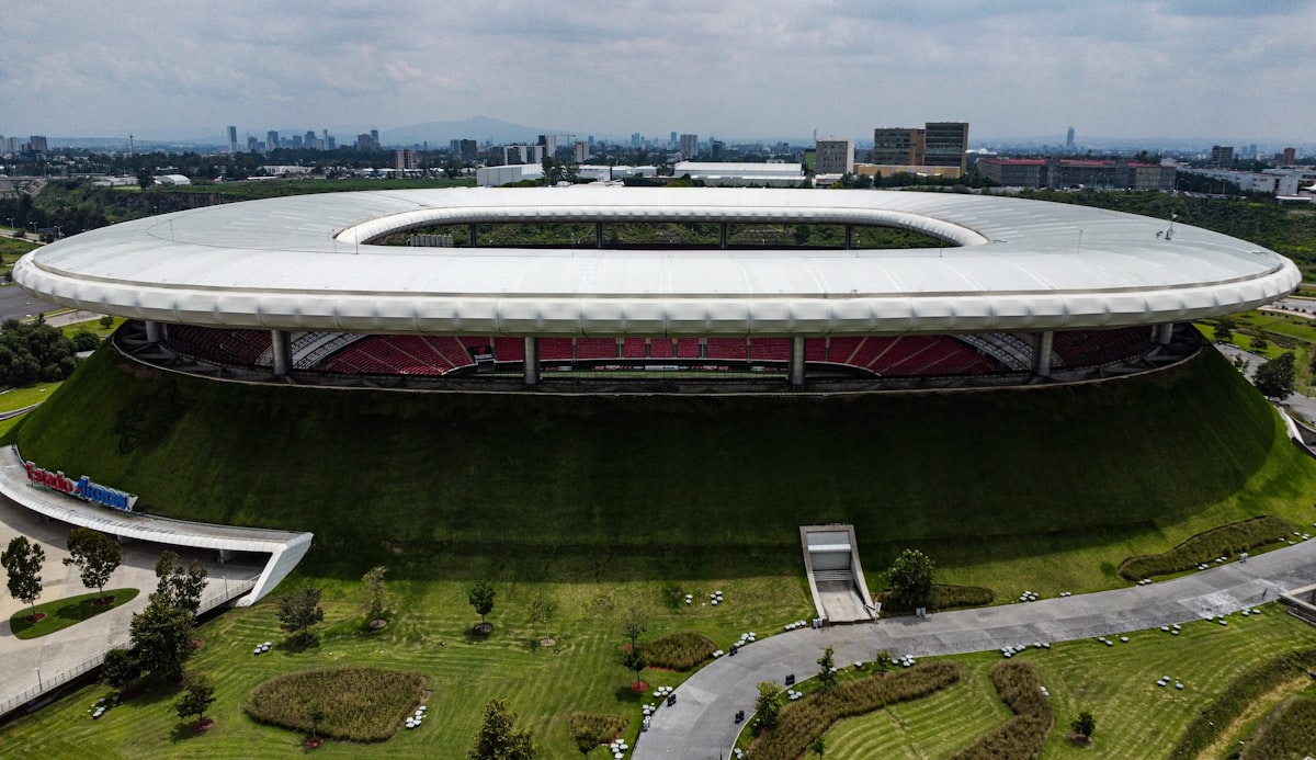 Aerial view of a soccer stadium in a city during a World Cup match