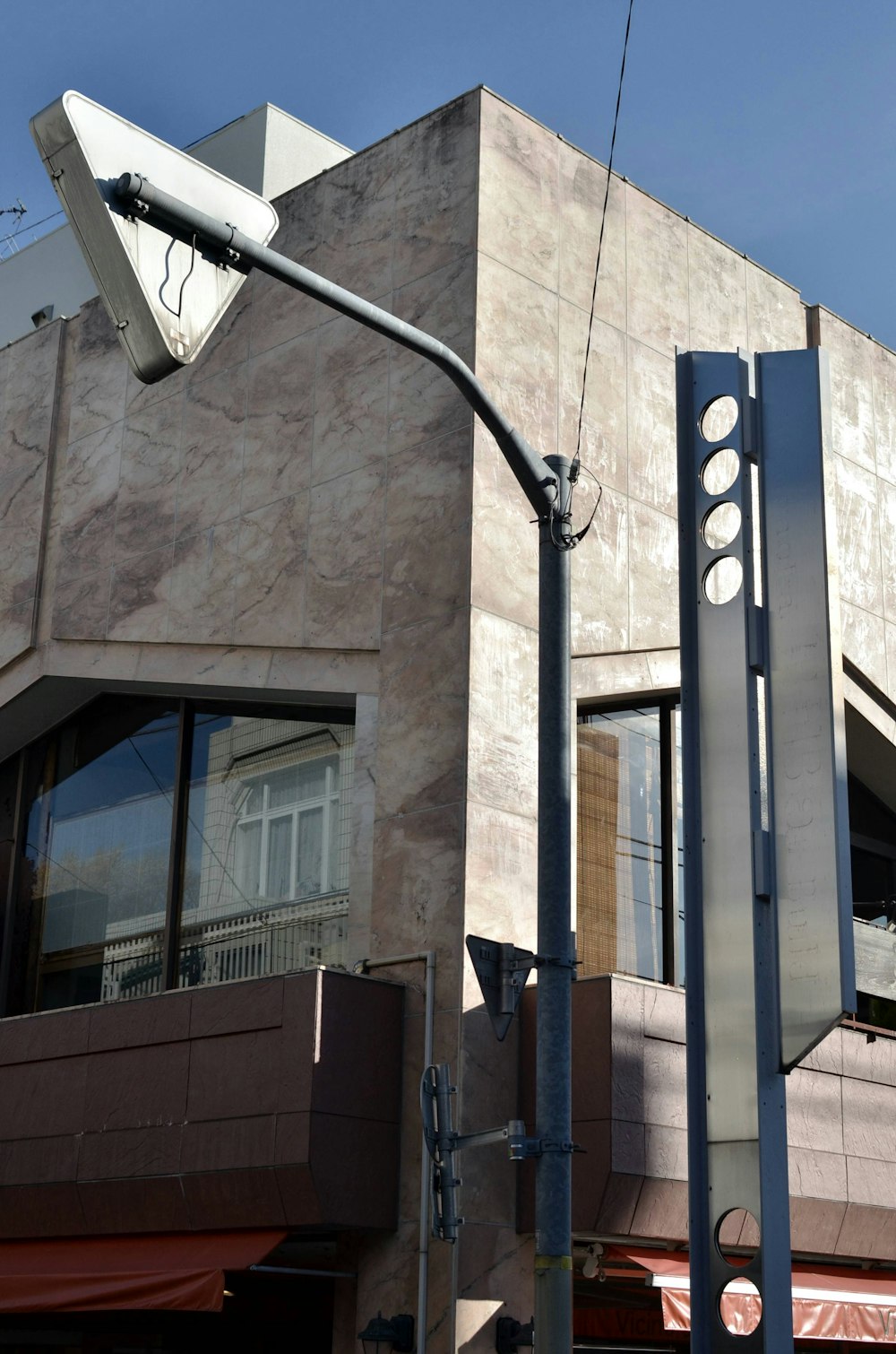 a street light on a pole in front of a building