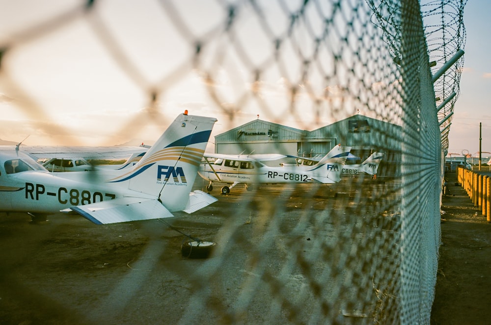 a couple of small planes parked next to each other