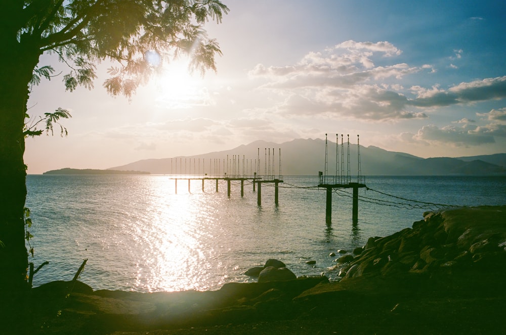 a large body of water sitting under a cloudy sky