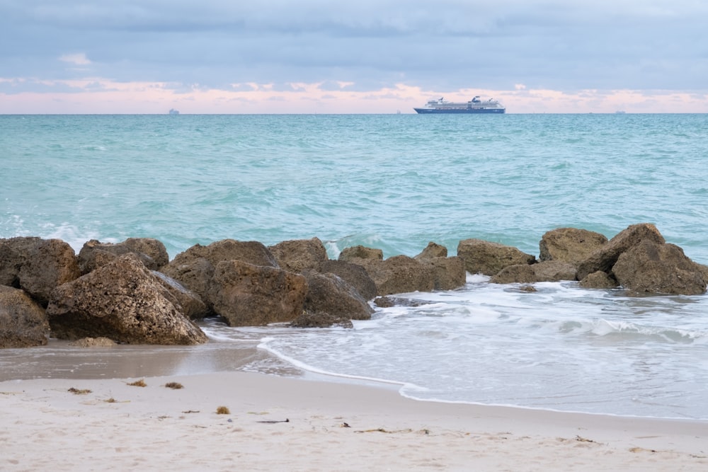 a boat is out in the distance on the water