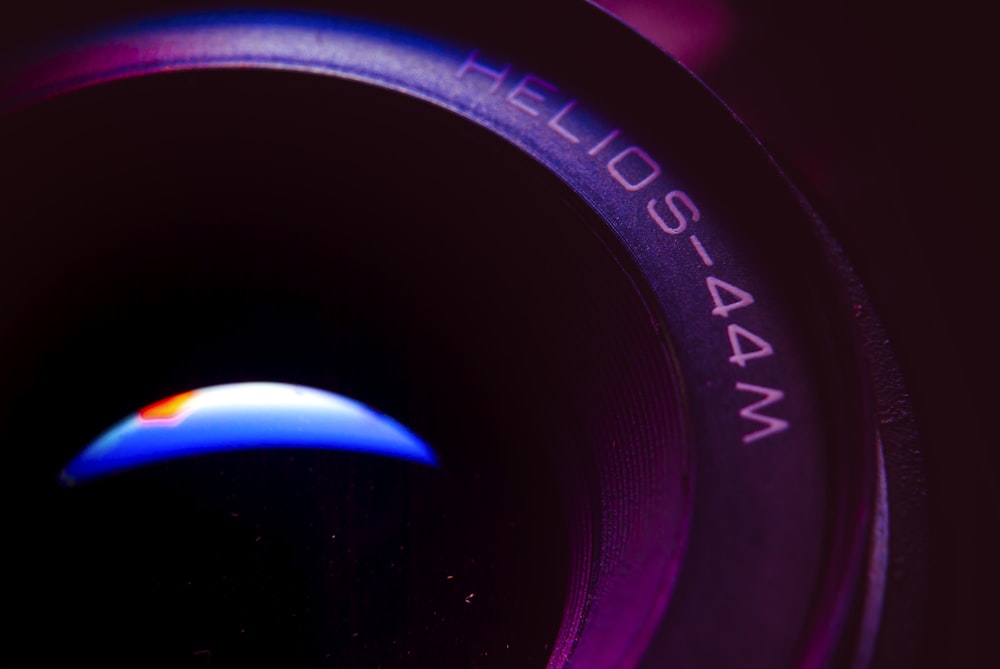 a close up of a camera lens with a blurry background