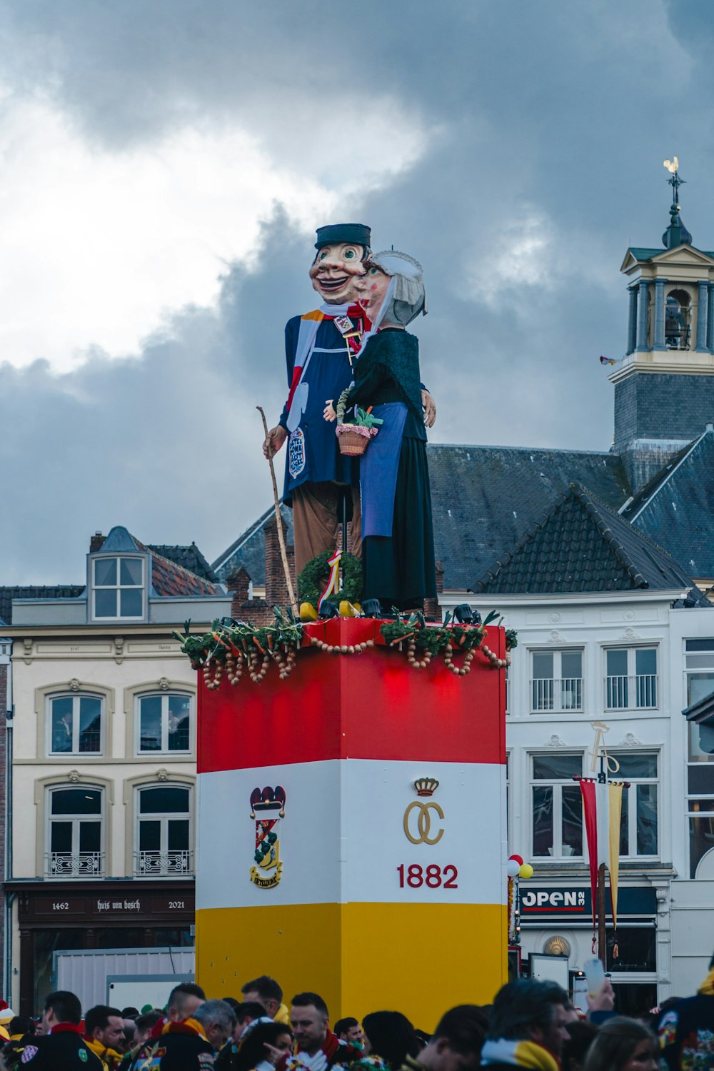 a large statue of a man on top of a building