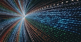 a very large tunnel of lights in the middle of a room