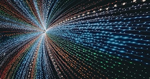 a very large tunnel of lights in the middle of a room