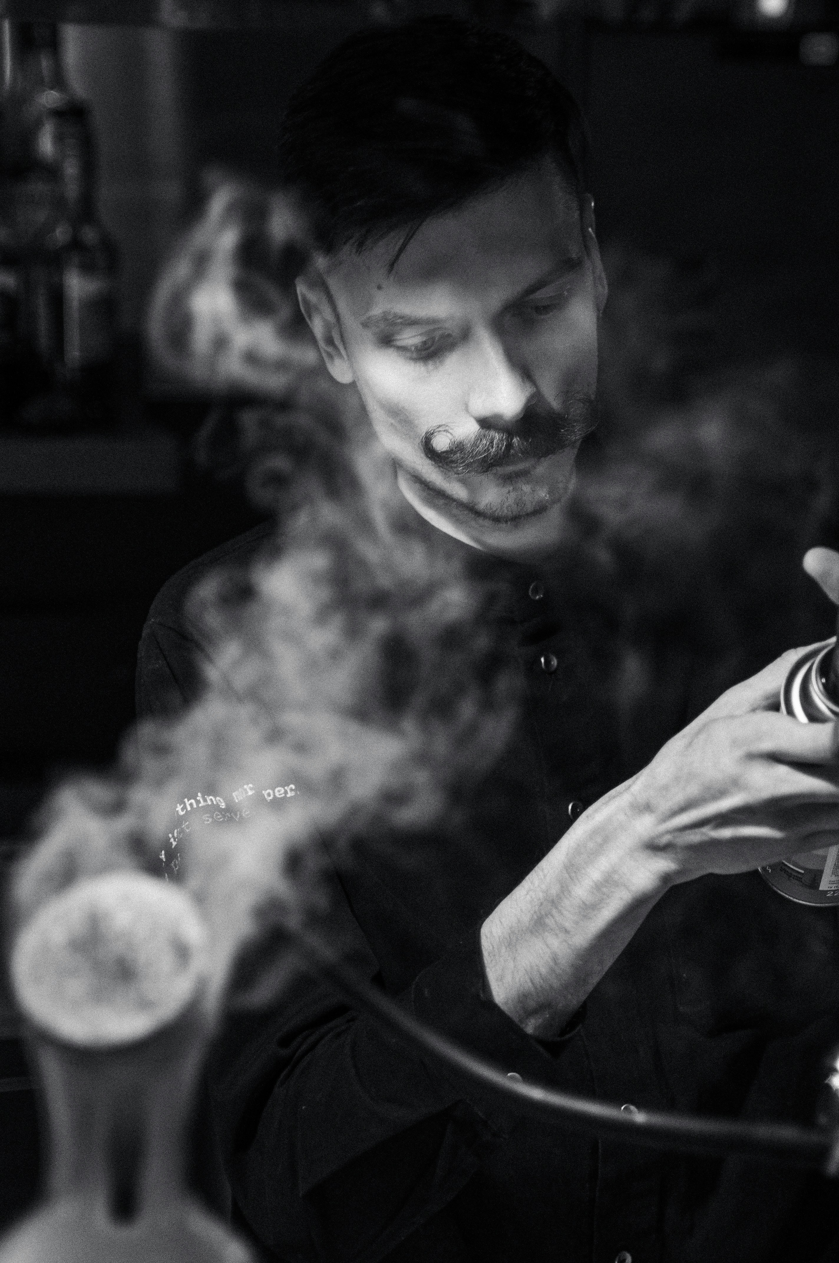 A man smoking a cigarette in a kitchen photo – Free Man Image on Unsplash, image size:3000x4517