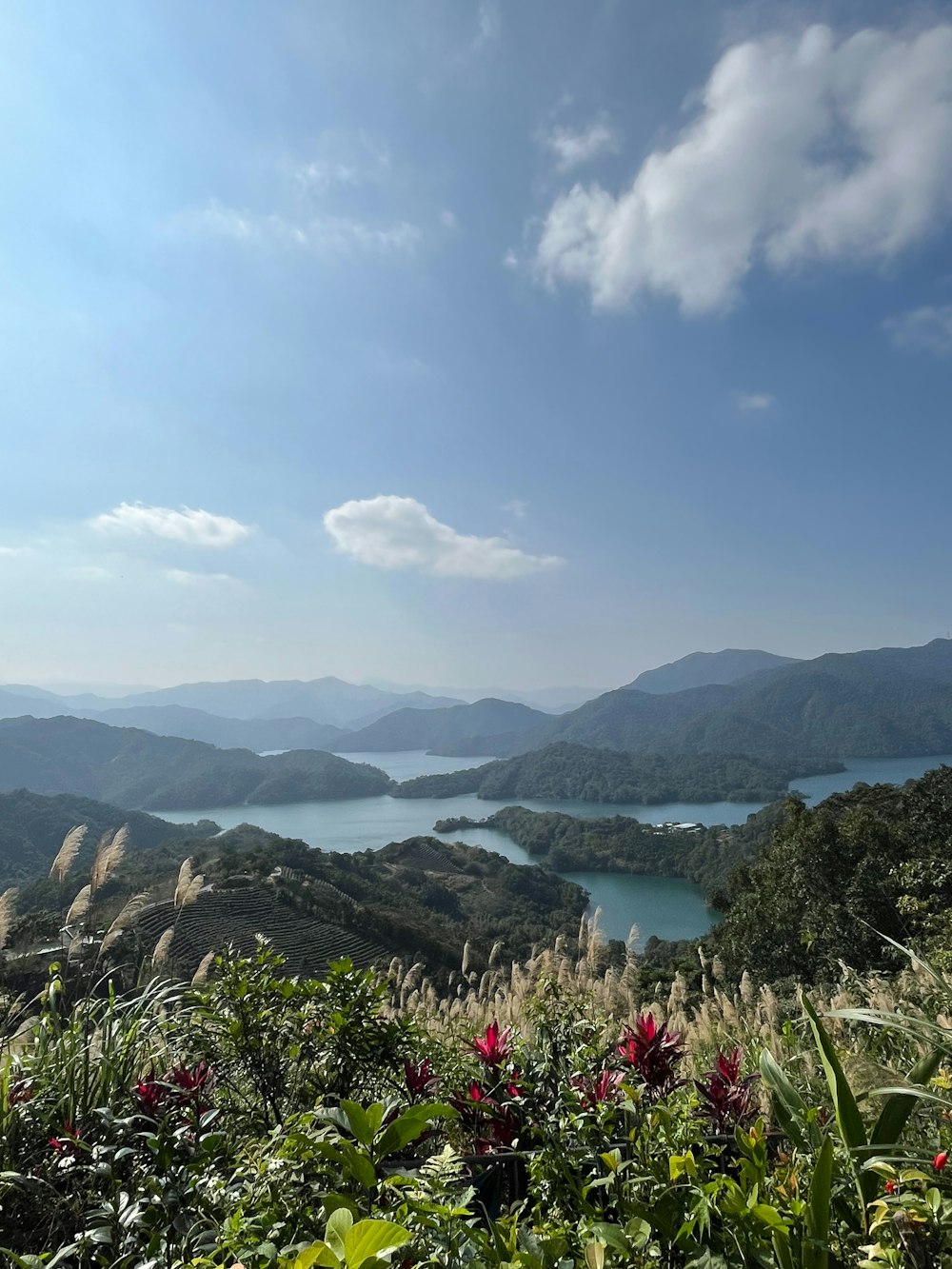 a scenic view of a lake surrounded by mountains