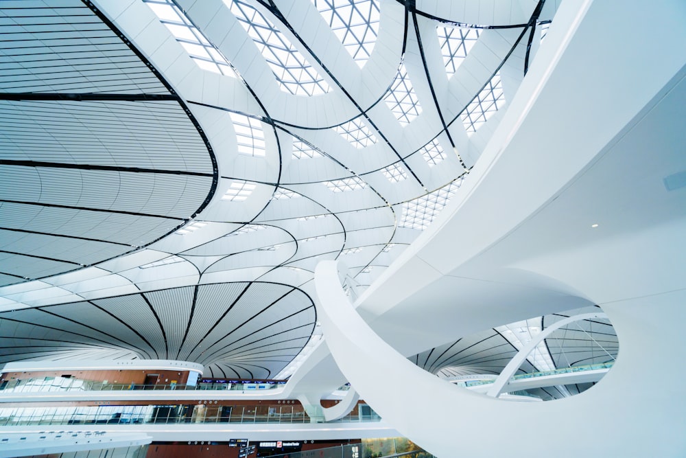 the ceiling of a large building with a spiral design