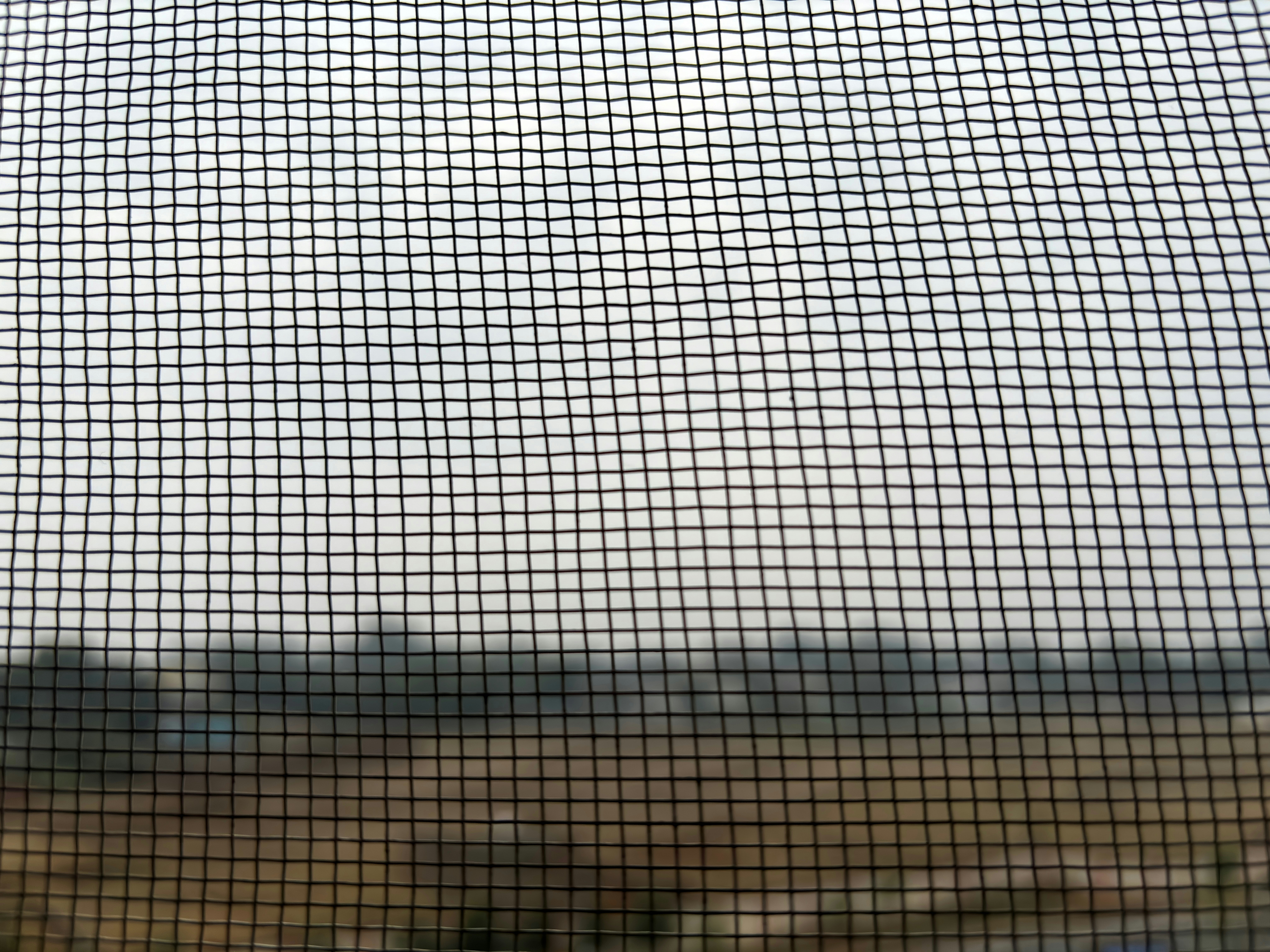 new screen mesh stretched over a wooden screen frame