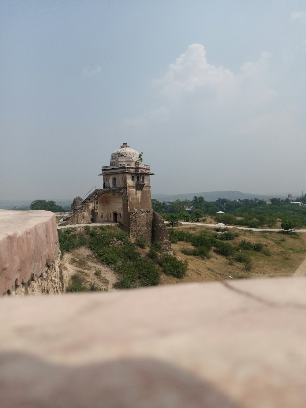 an old building with a dome on top of it