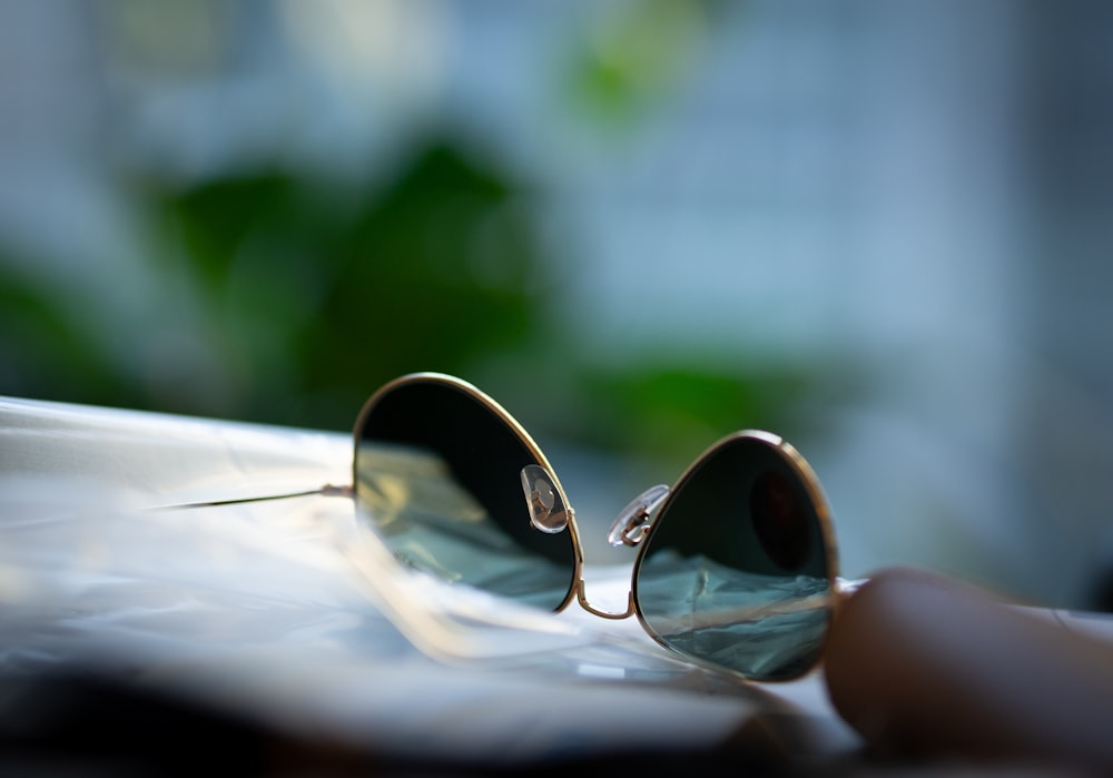 a pair of sunglasses sitting on top of a table