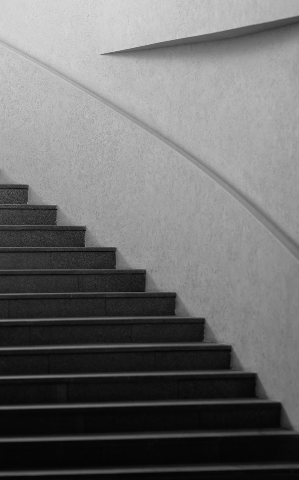 a black and white photo of a stair case