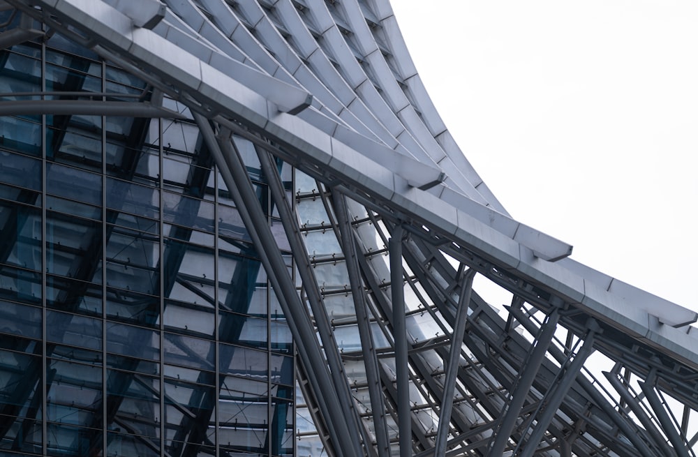 a close up of a very tall building with a clock on it's side