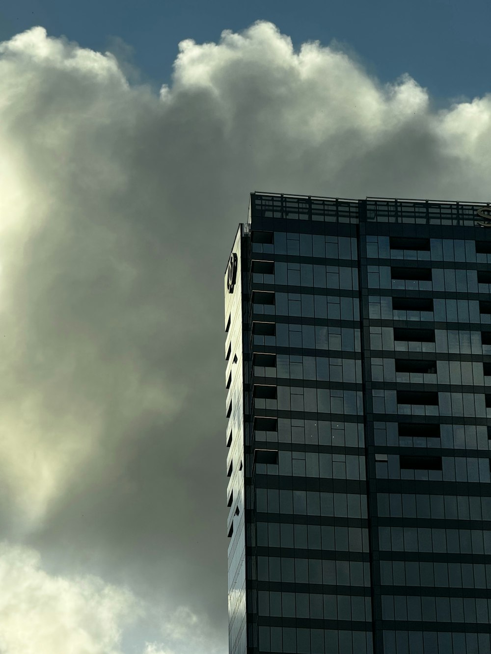 a very tall building with a clock on it's side