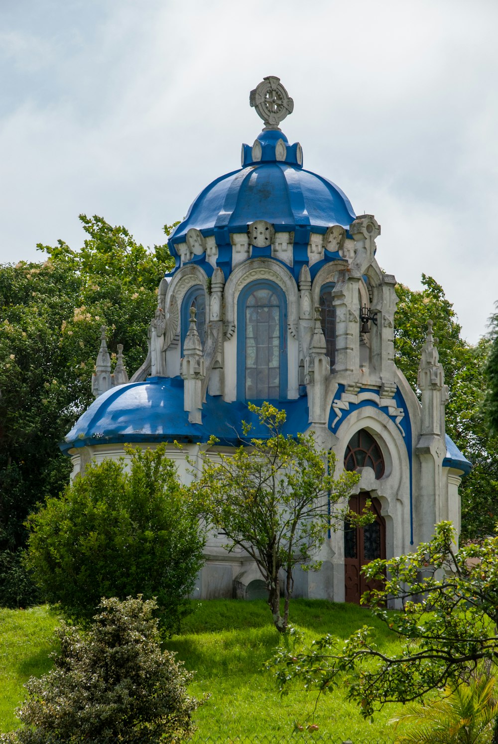 a blue and white building with a blue roof