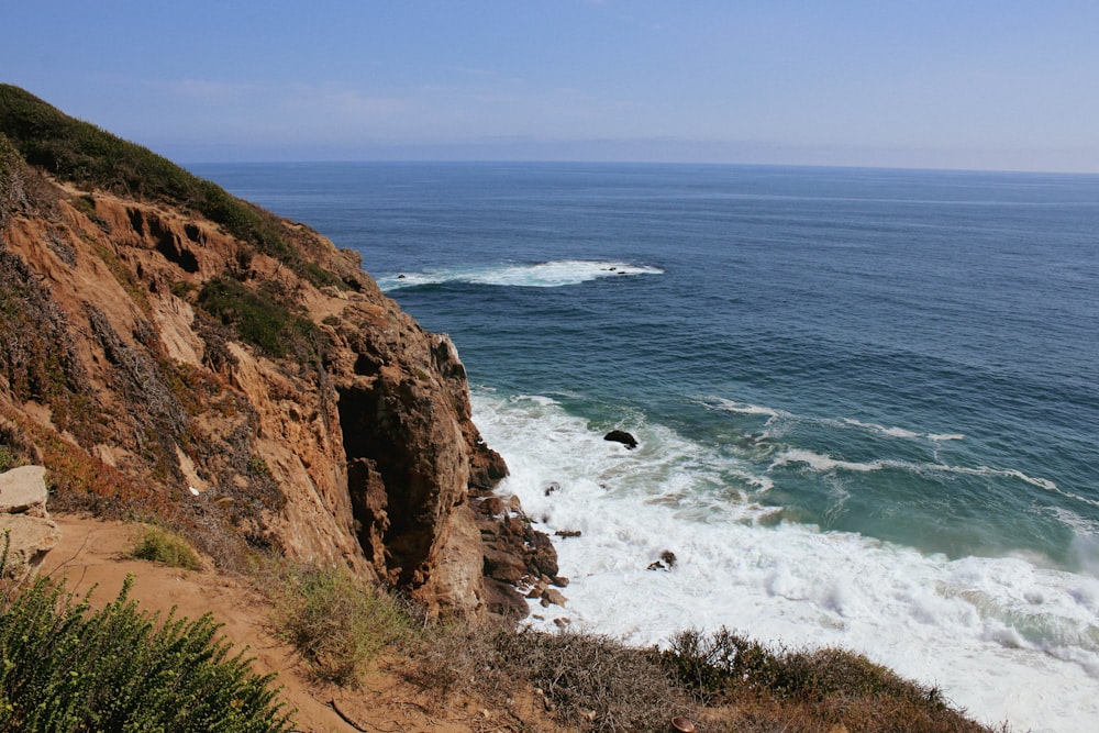 a view of the ocean from a cliff