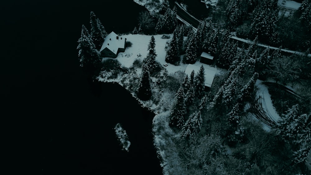 an aerial view of a house in the snow